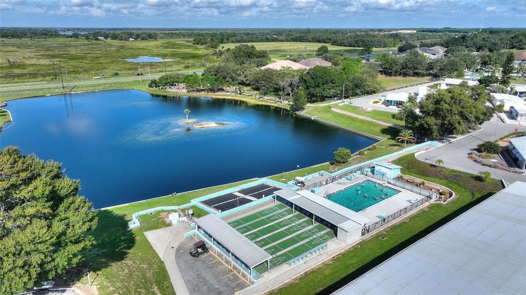 251 Patterson Road, Unit J19 Haines City, FL 33844 - Photo 21 of 30 an aerial view of a house with a lake view