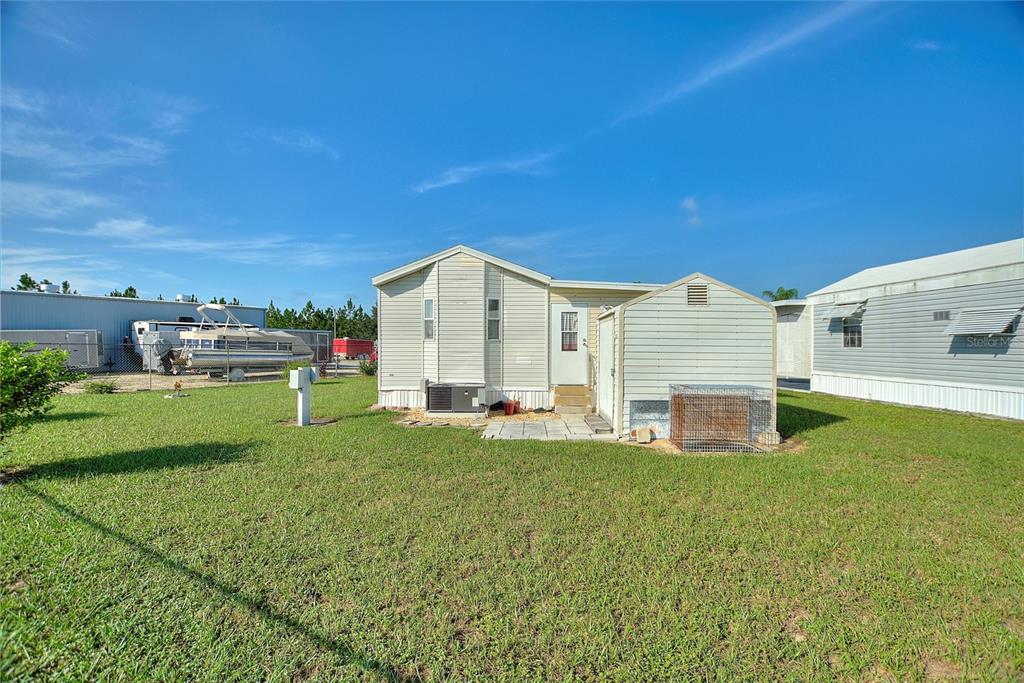 251 Patterson Road, Unit J19 Haines City, FL 33844 - Photo 5 of 30 a view of a house with backyard