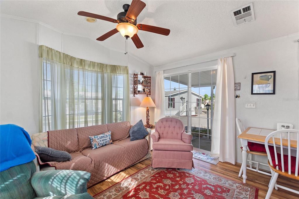 251 Patterson Road, Unit J19 Haines City, FL 33844 - Photo 7 of 30 a living room with furniture and a window
