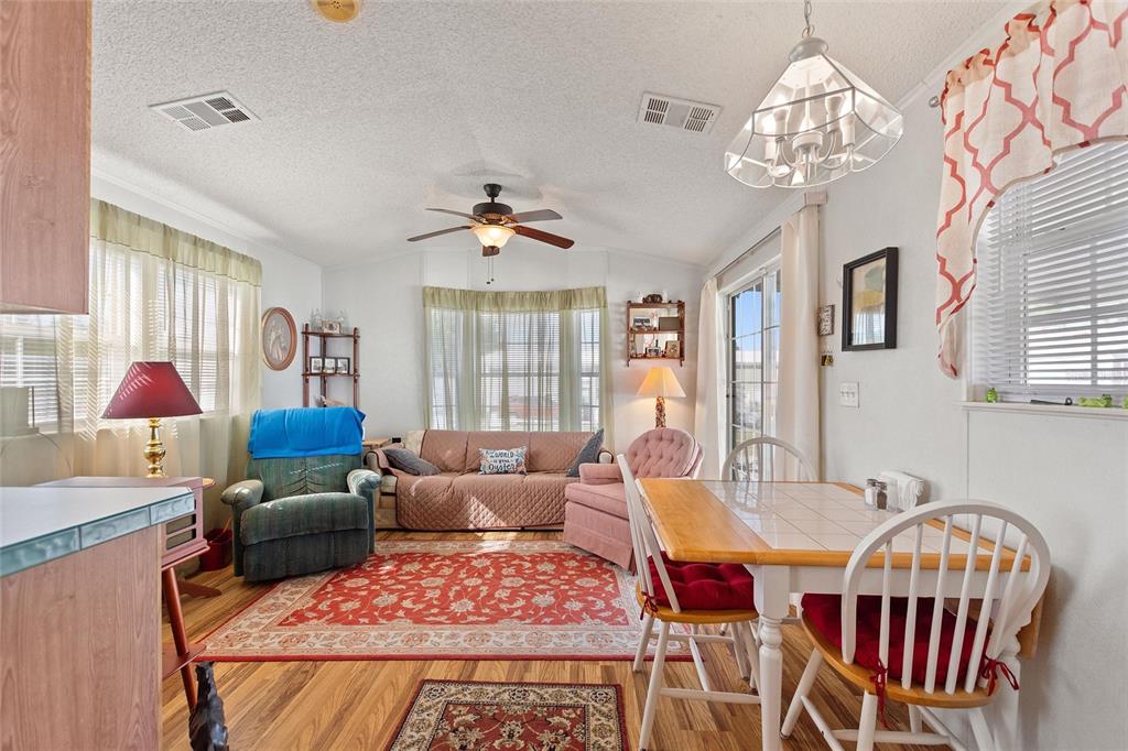 251 Patterson Road, Unit J19 Haines City, FL 33844 - Photo 10 of 30 a living room with furniture flowerpot and window