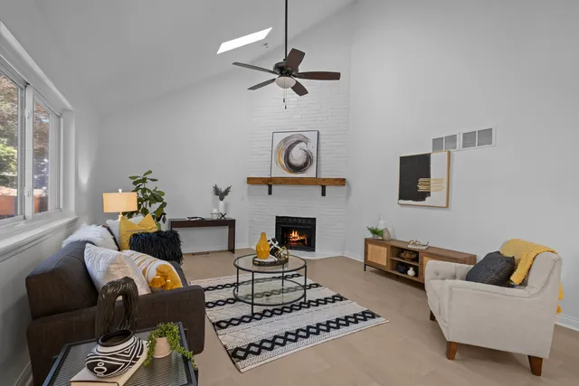 a living room with furniture and a fireplace