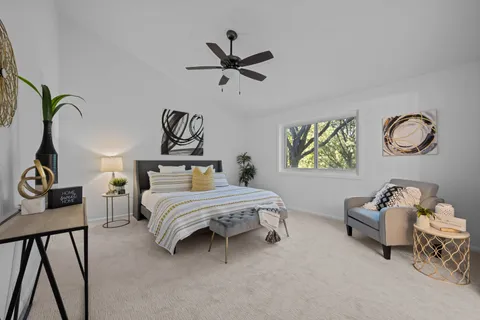 a bedroom with bed and window