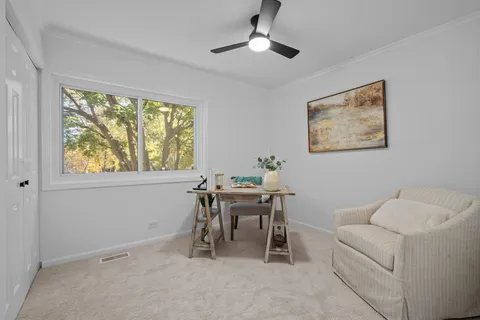 a work room with furniture and a window