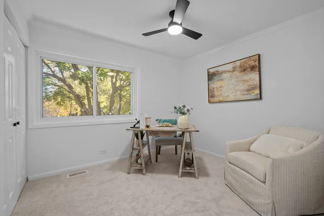 a work room with furniture and a window