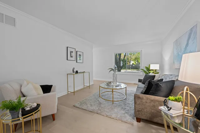 a living room with furniture and a lamp