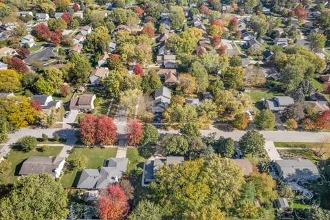 an aerial view of residential houses with outdoor space