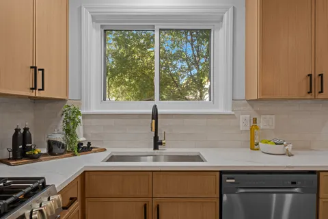a kitchen with a sink and cabinets
