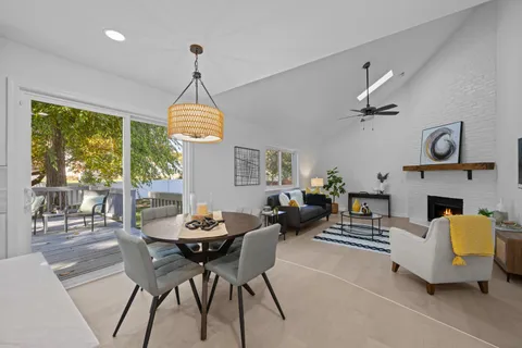 a view of a dining room with furniture window and outside view