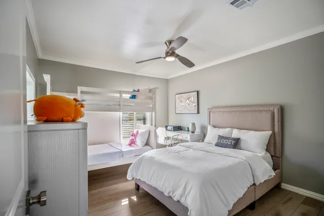 a bedroom with a bed and a lamp