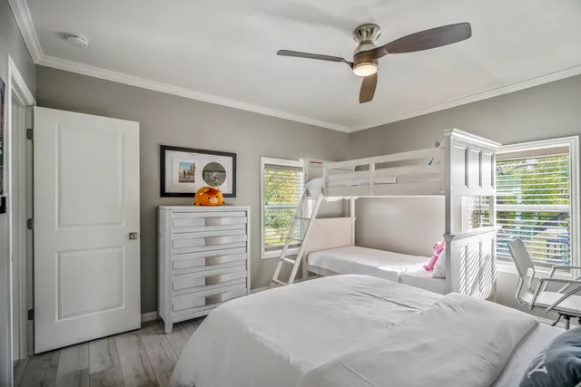 a bedroom with a bed and a desk