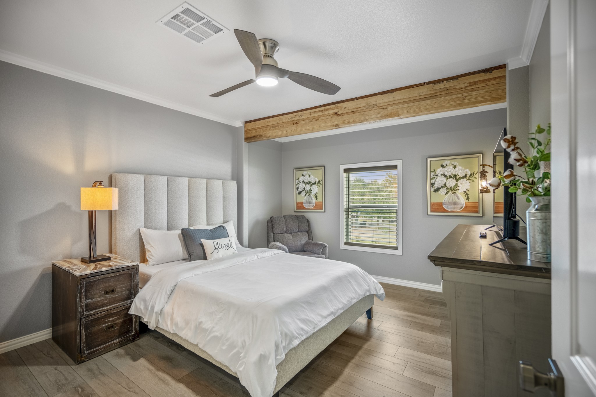 3207 Brownie Campbell Road Houston, TX 77086 - Photo 34 of 49 a bedroom with a bed and wooden floor