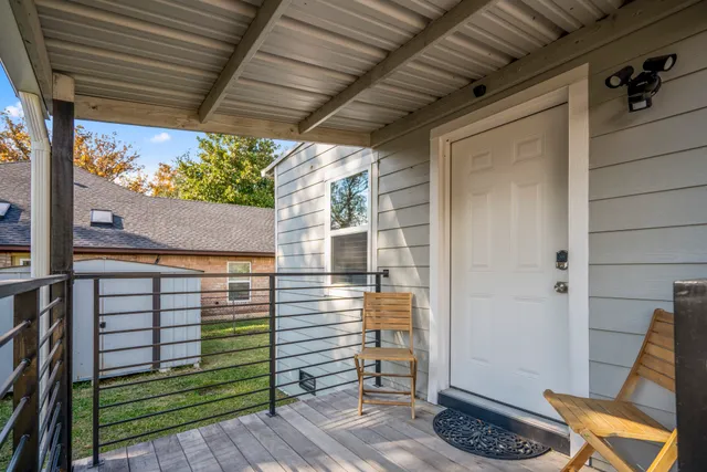 a view of a porch with wooden floor