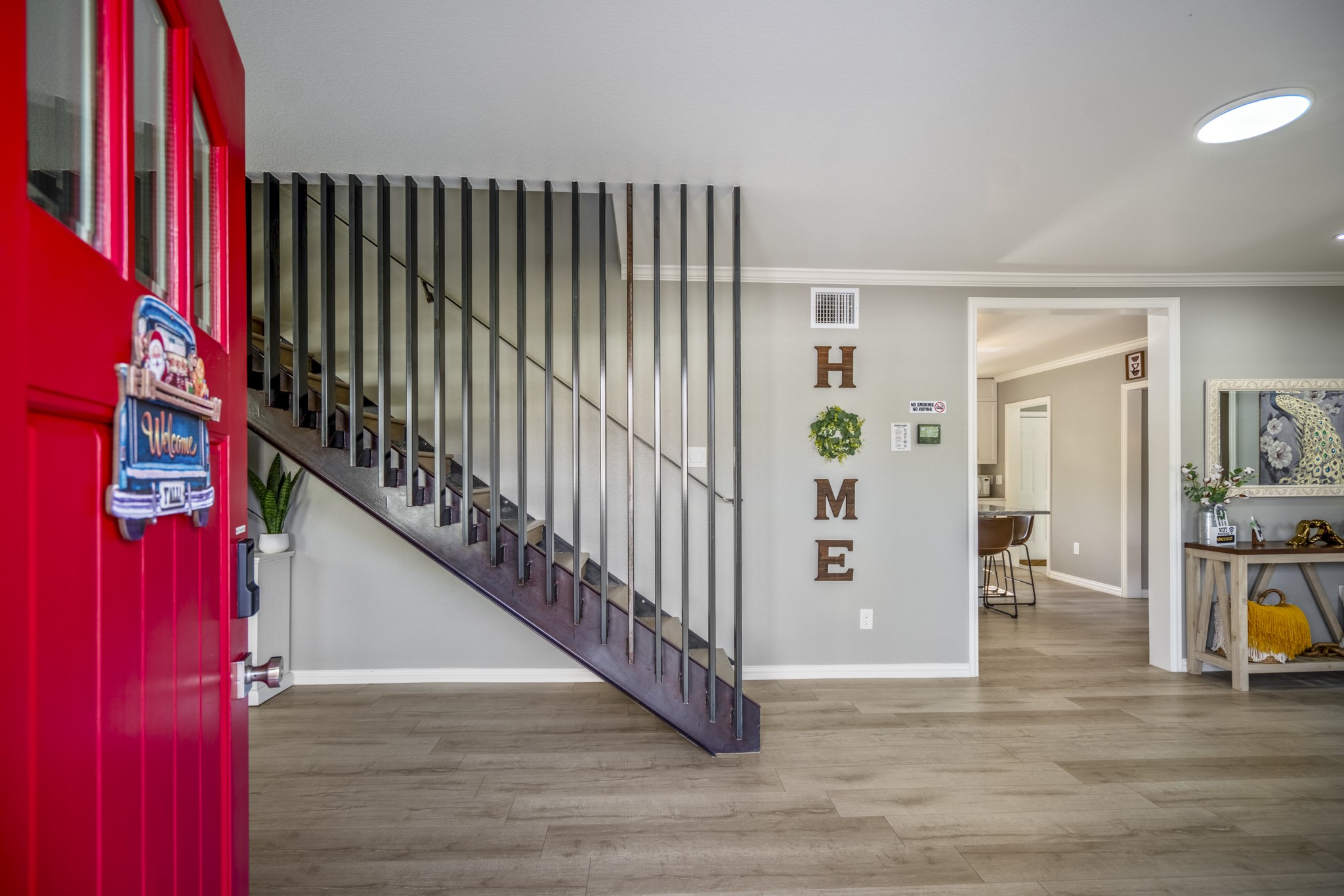 3207 Brownie Campbell Road Houston, TX 77086 - Photo 6 of 49 a view of hallway with wooden floor and stairs