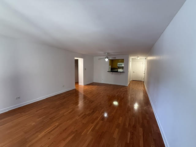 677 South River Road, Unit 2A Des Plaines, IL 60016 - Photo 3 of 15 a view of empty room with wooden floor