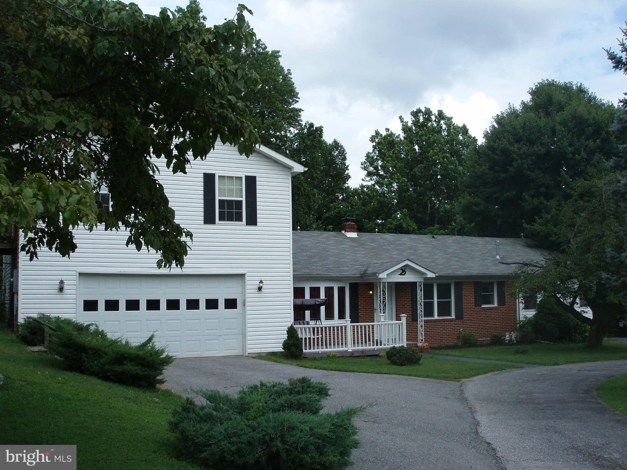 200 Cox Road Huntingtown, MD 20639 - Photo 1 of 27 a view of house with garden and trees