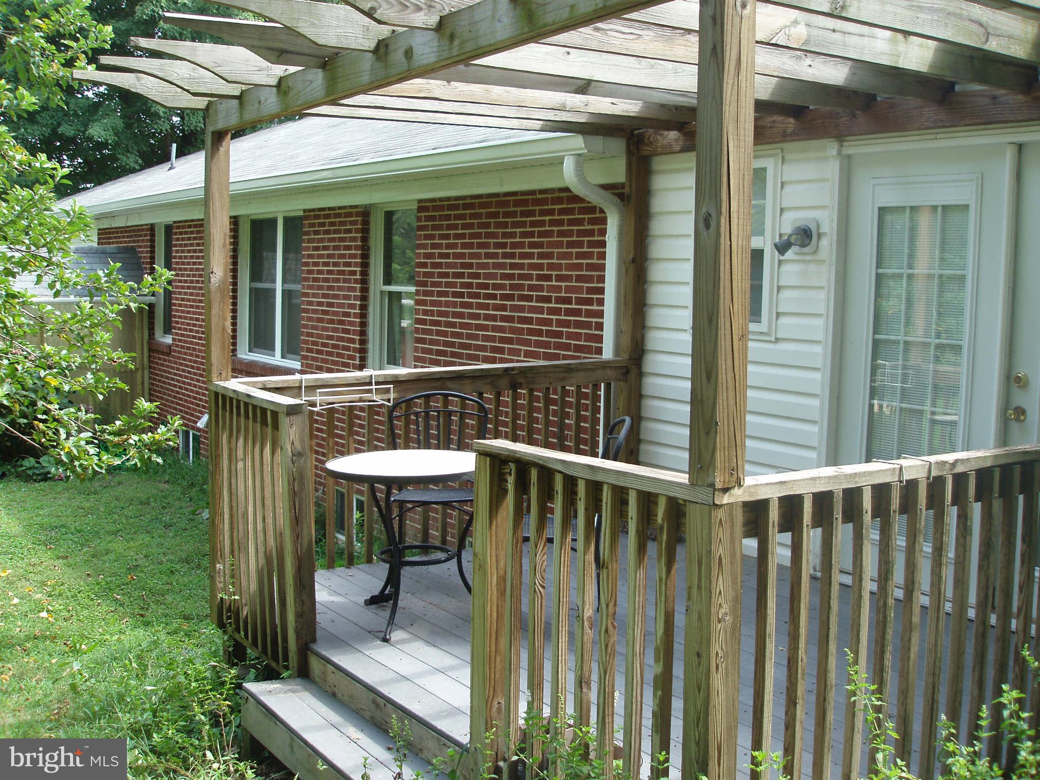 200 Cox Road Huntingtown, MD 20639 - Photo 11 of 27 a view of house with backyard outdoor seating and green space