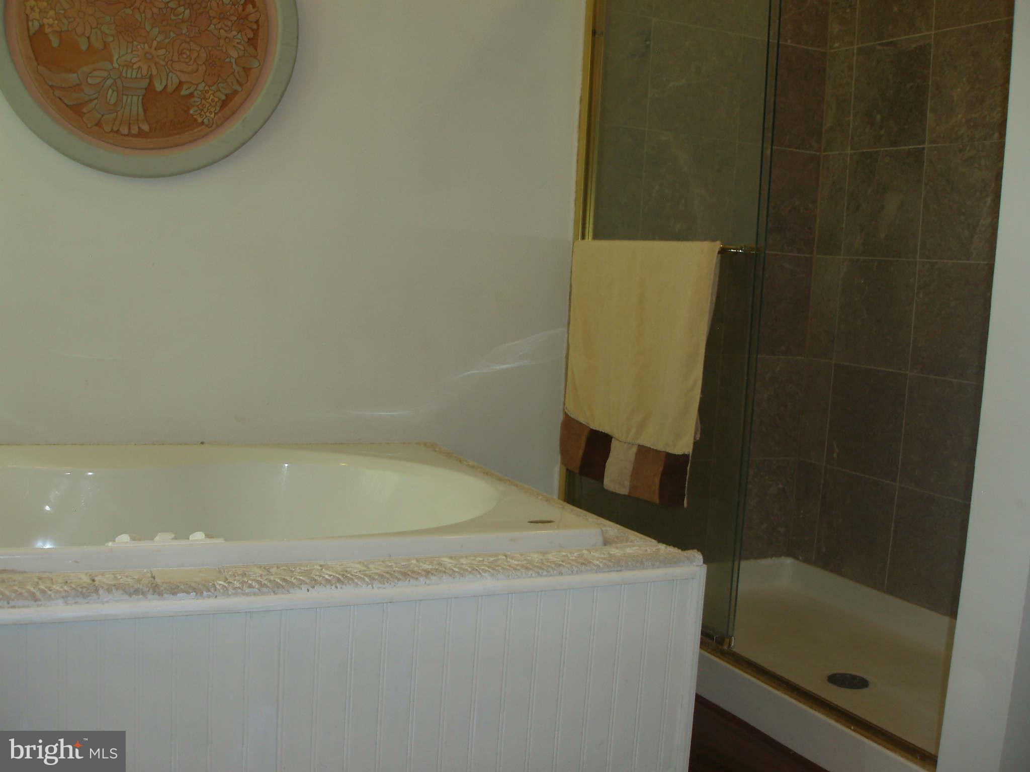 200 Cox Road Huntingtown, MD 20639 - Photo 14 of 27 a bathroom with a bathtub
