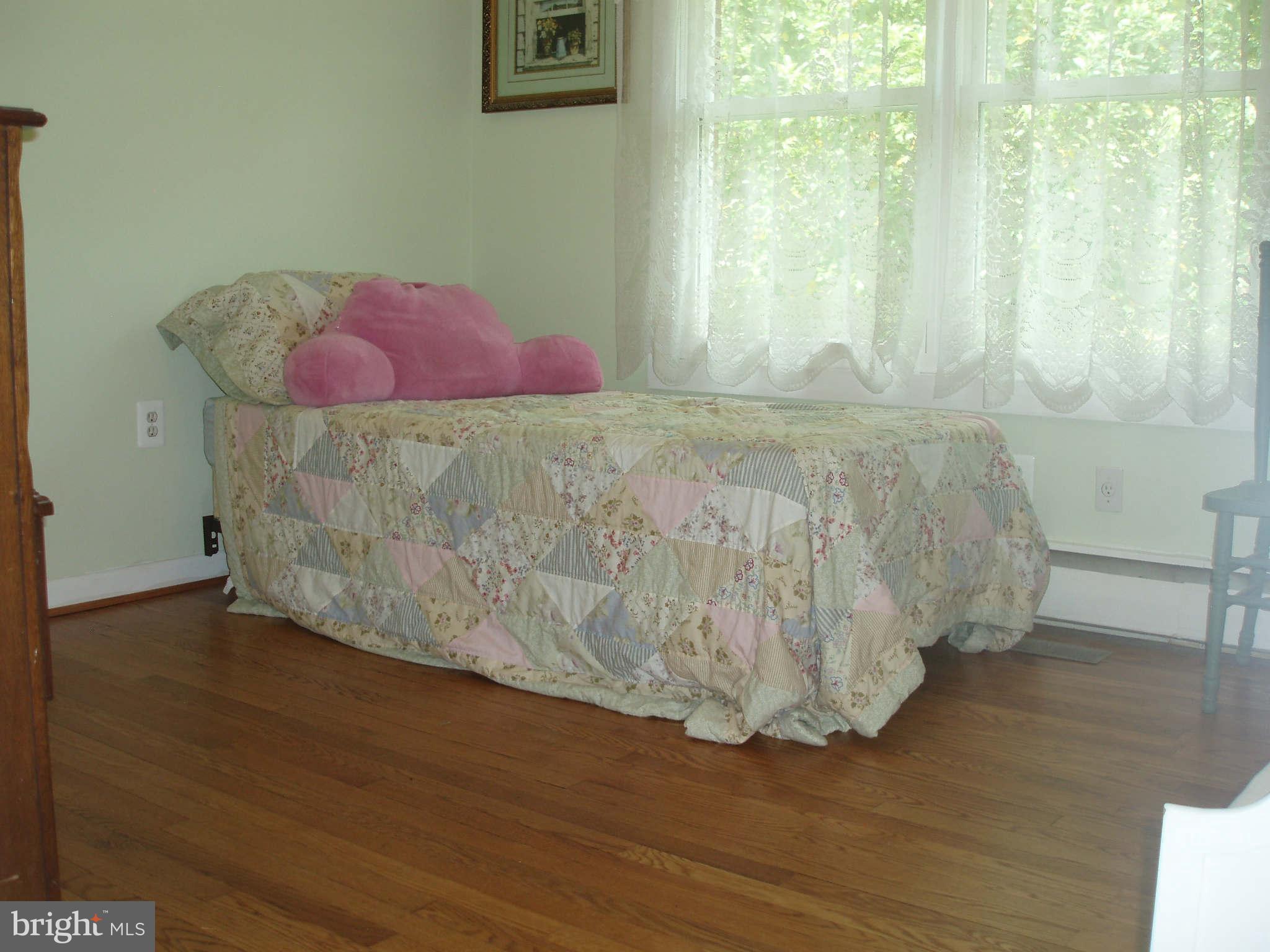 200 Cox Road Huntingtown, MD 20639 - Photo 17 of 27 a bedroom with a bed and a window