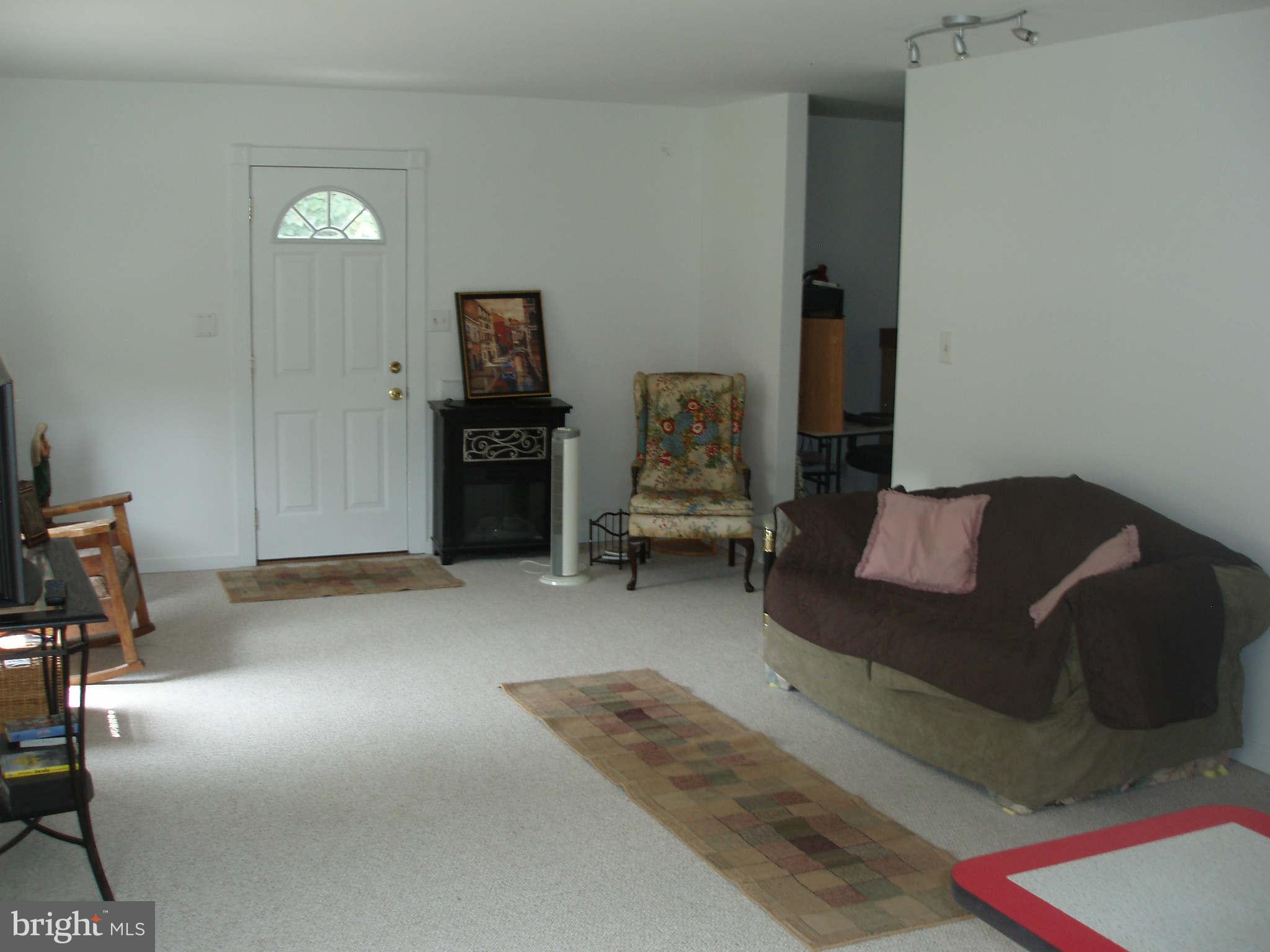 200 Cox Road Huntingtown, MD 20639 - Photo 22 of 27 a living room with furniture
