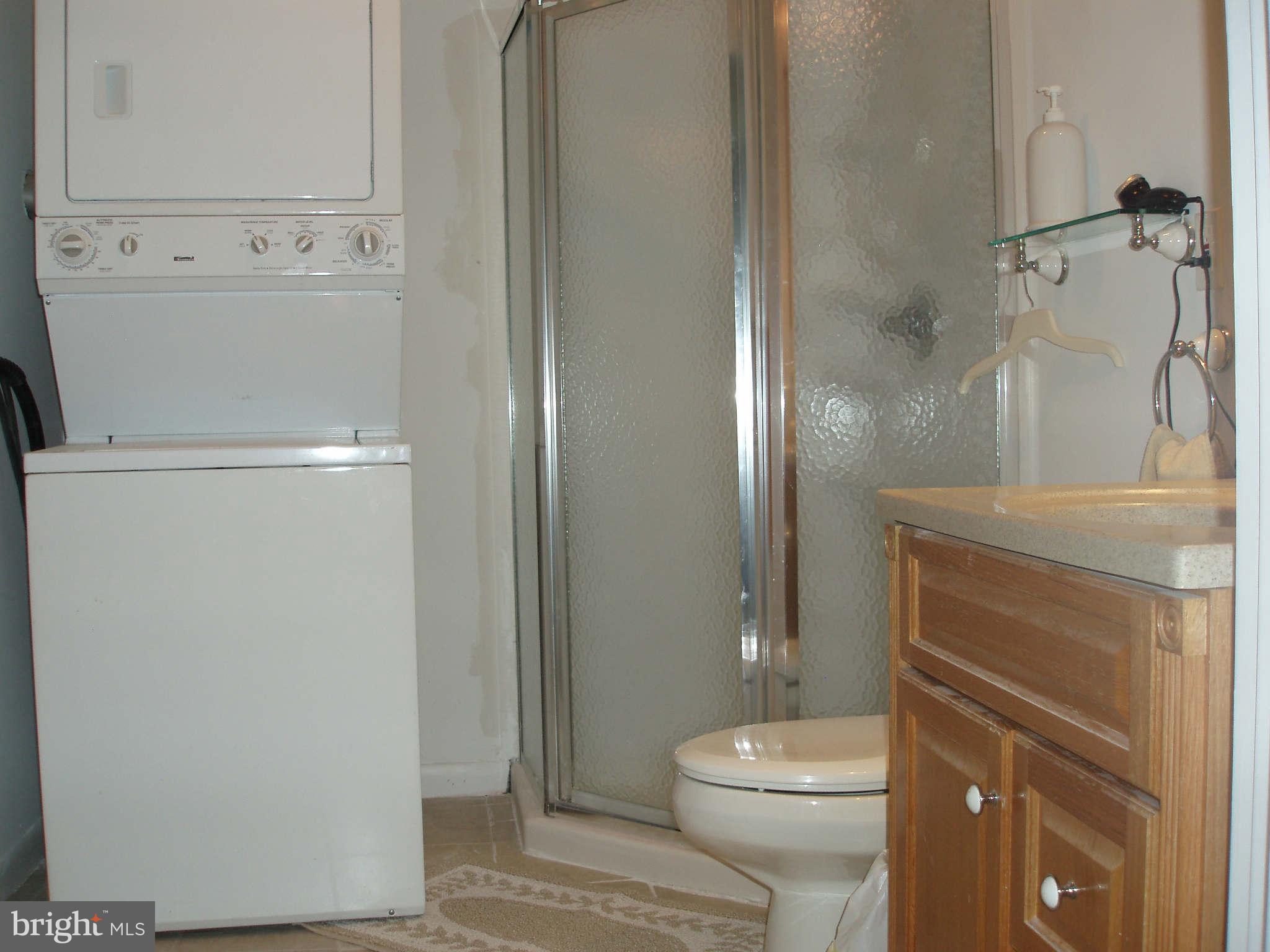 200 Cox Road Huntingtown, MD 20639 - Photo 25 of 27 a white toilet sitting next to a bathroom sink