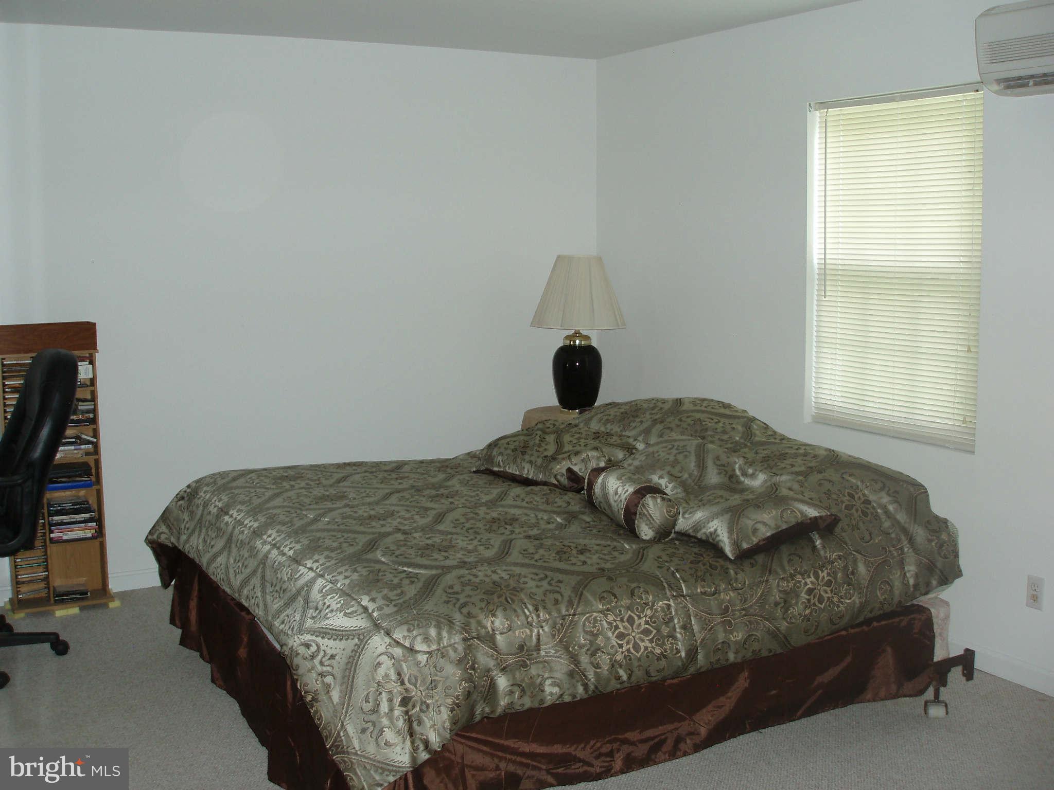 200 Cox Road Huntingtown, MD 20639 - Photo 27 of 27 a bedroom with a bed and a window