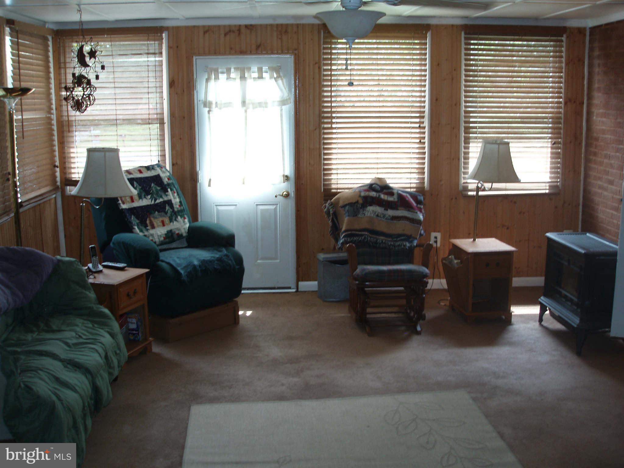 200 Cox Road Huntingtown, MD 20639 - Photo 9 of 27 a living room with furniture and a window