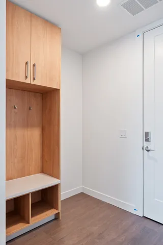a view of an empty room and wooden floor