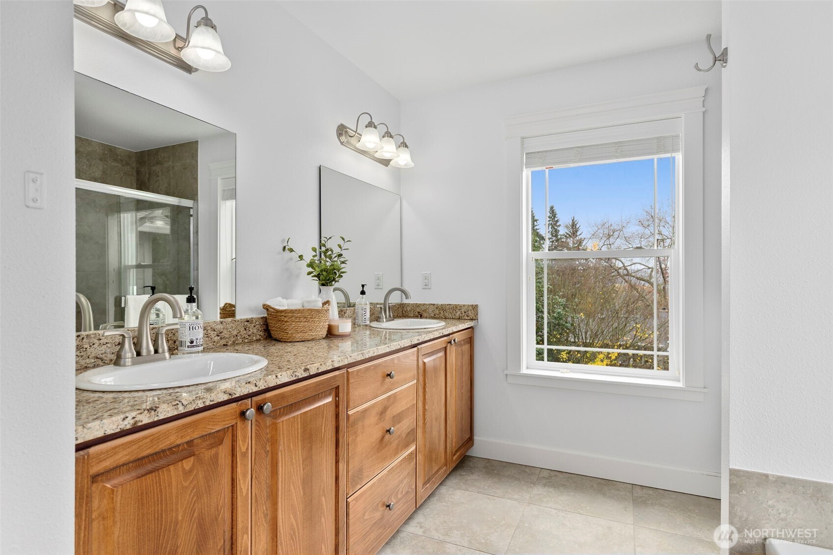 7650 Northeast 204th Place Kenmore, WA 98028 - Photo 22 of 39 a bathroom with a double vanity sink and a mirror
