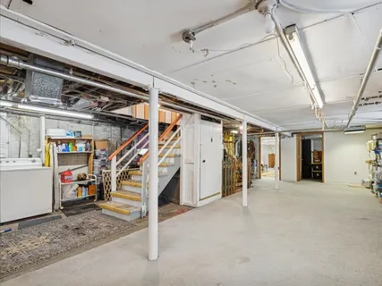 a view of a hallway with stairs