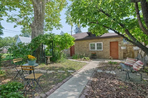 a backyard of a house with seating space