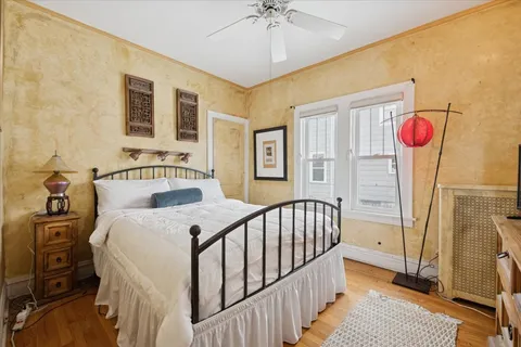 a bedroom with a bed and a window