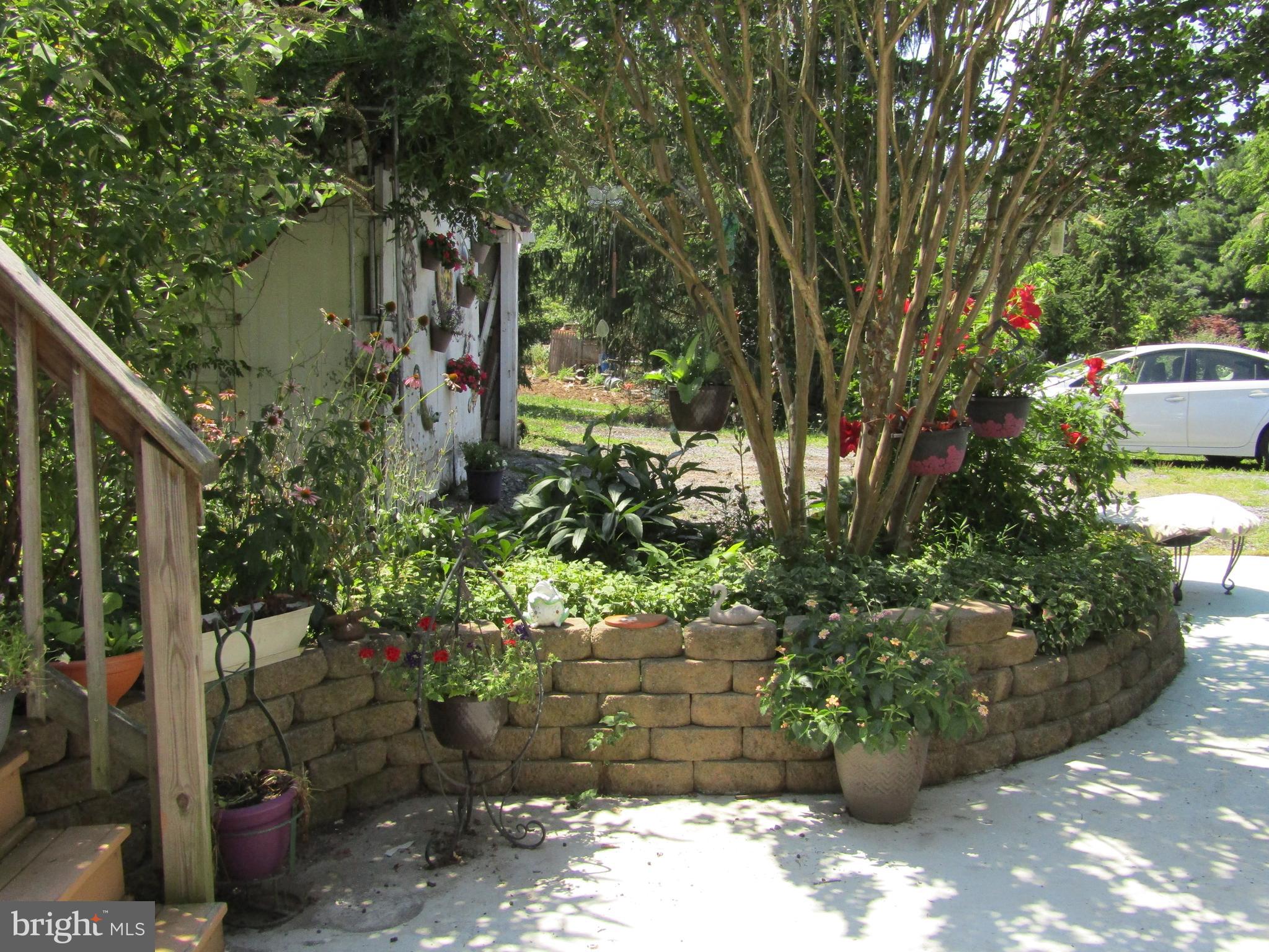 Several Terraced Landscape Beds  at Rear Patio.