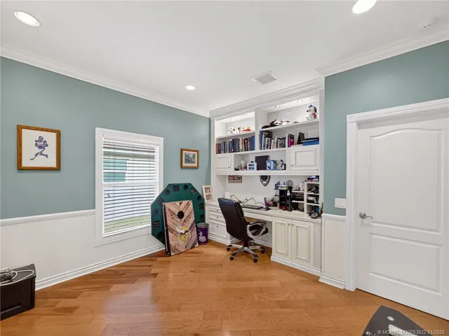 a kitchen with granite countertop a sink and wooden cabinets