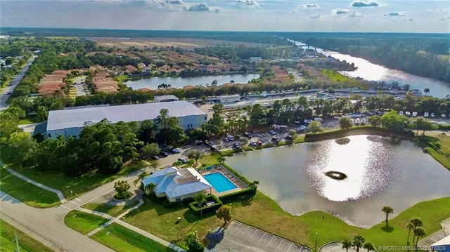 an aerial view of a house with a lake view
