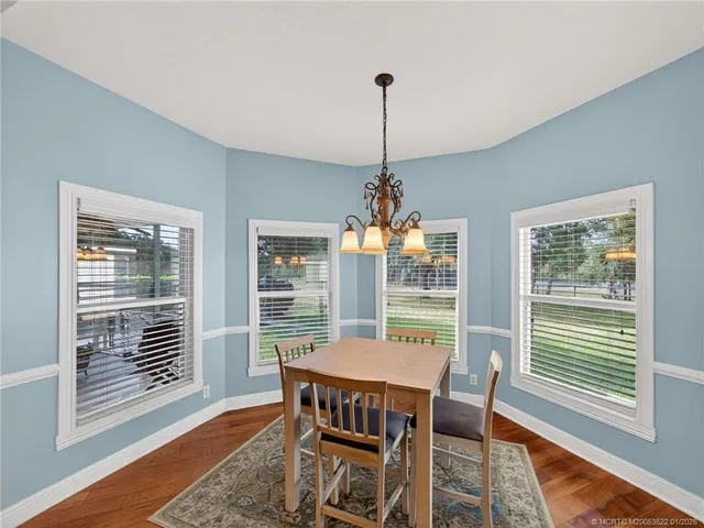 a kitchen with stainless steel appliances granite countertop a sink and a stove