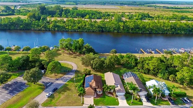 a view of a lake with a house in the background