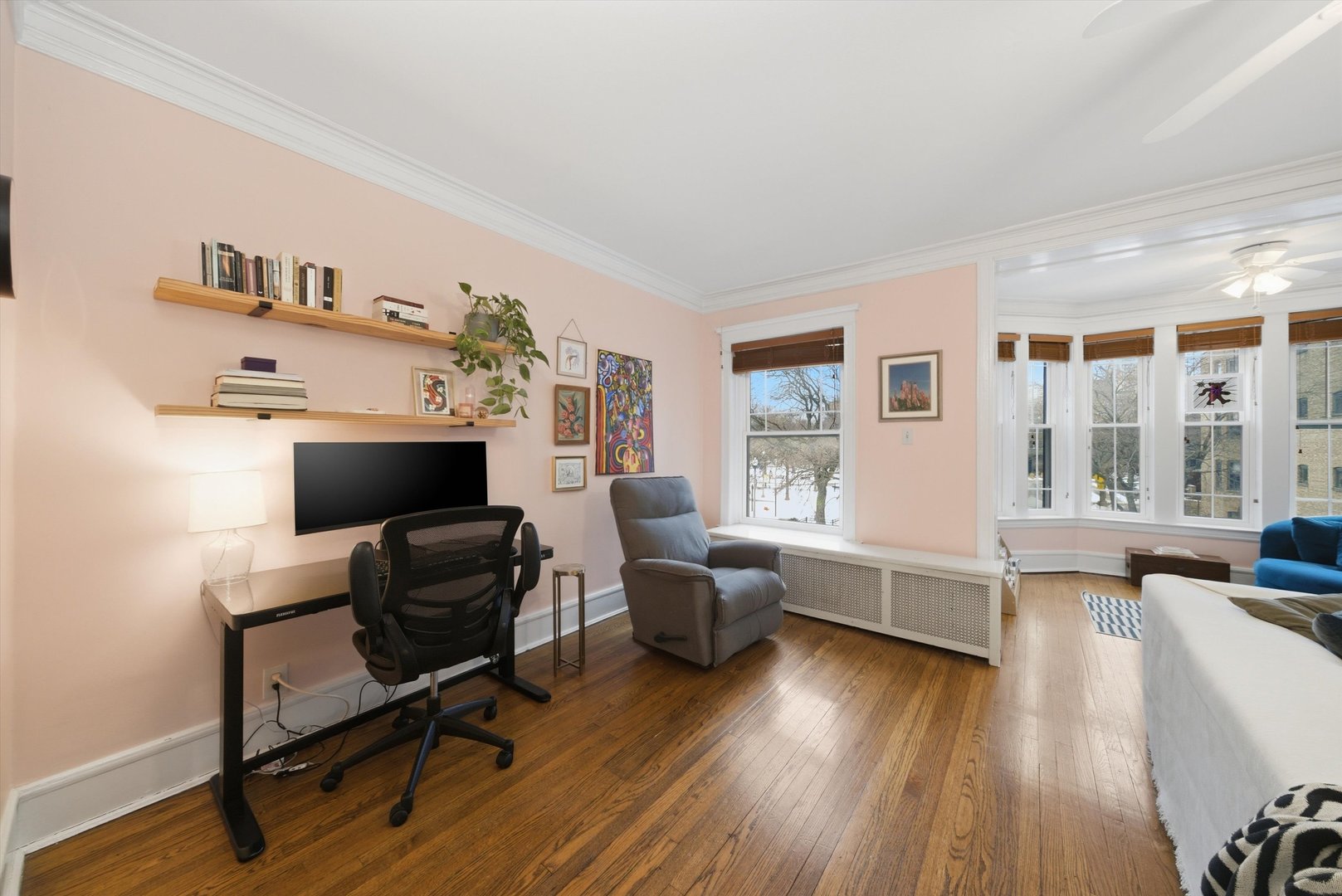 939 West Ainslie Street, Unit 2E Chicago, IL 60640 - Photo 13 of 47 a work room with furniture and wooden floor