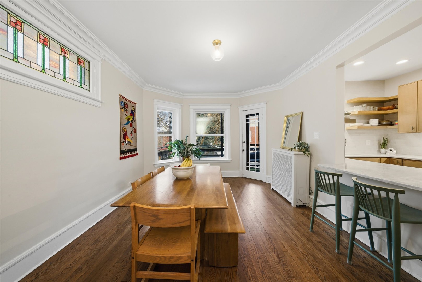 939 West Ainslie Street, Unit 2E Chicago, IL 60640 - Photo 25 of 47 a view of a dining room with furniture window and wooden floor