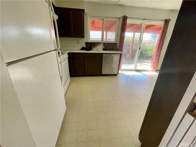 a kitchen with stainless steel appliances a refrigerator and a sink