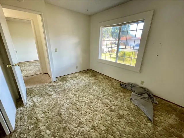 a view of an empty room and window