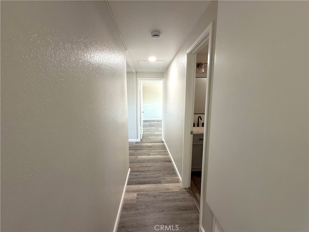 3445 Sparrow Circle Riverside, CA 92503 - Photo 15 of 41 a view of a hallway with wooden floor