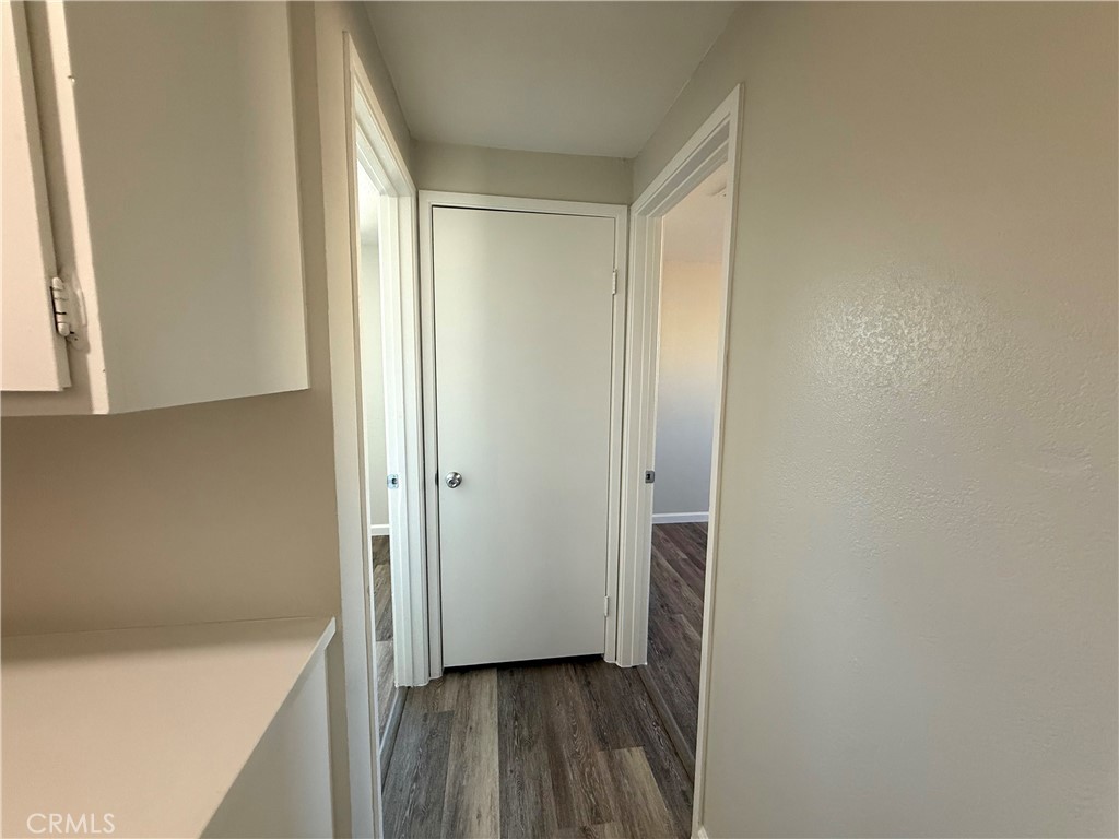 3445 Sparrow Circle Riverside, CA 92503 - Photo 19 of 41 a view of hallway with a large window and wooden floor
