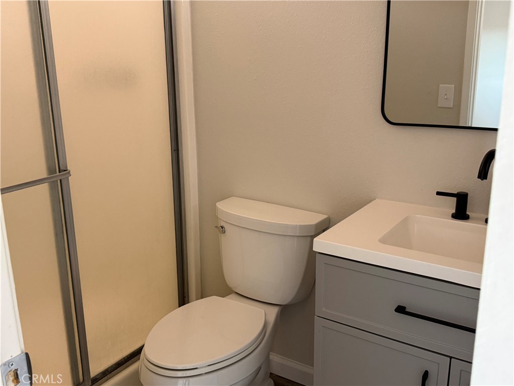 3445 Sparrow Circle Riverside, CA 92503 - Photo 23 of 41 a white toilet sitting next to a bathroom sink