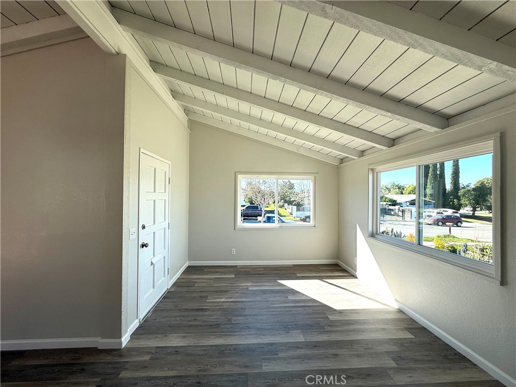 3445 Sparrow Circle Riverside, CA 92503 - Photo 10 of 41 a view of an empty room with wooden floor and a window
