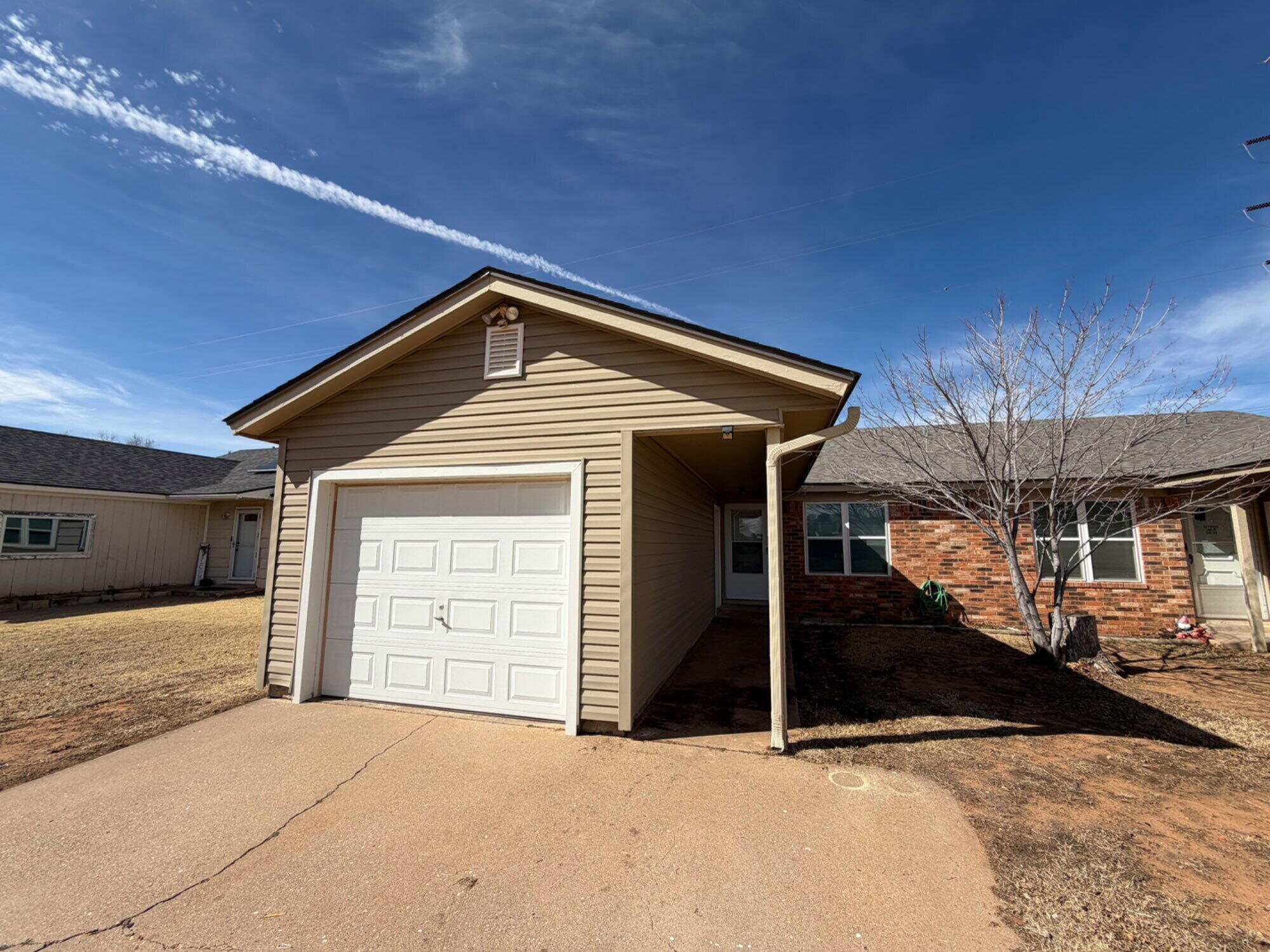 9604 Elgin Avenue, Unit B Lubbock, TX 79423 - Photo 1 of 12 a front view of a house