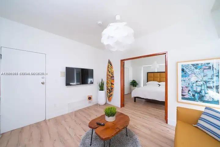 227 1st Street, Unit 7 Miami Beach, FL 33139 - Photo 4 of 12 a living room with furniture and a flat screen tv
