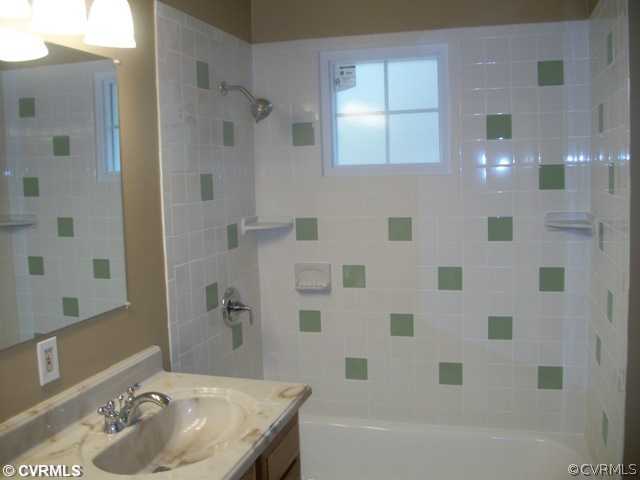 14121 Beach Road Chesterfield, VA 23838 - Photo 11 of 14 a bathroom with a sink shower and a mirror