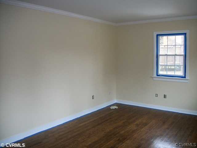 14121 Beach Road Chesterfield, VA 23838 - Photo 4 of 14 an empty room with wooden floor and windows