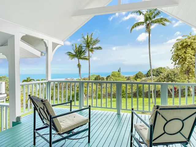 a view of a balcony with chairs