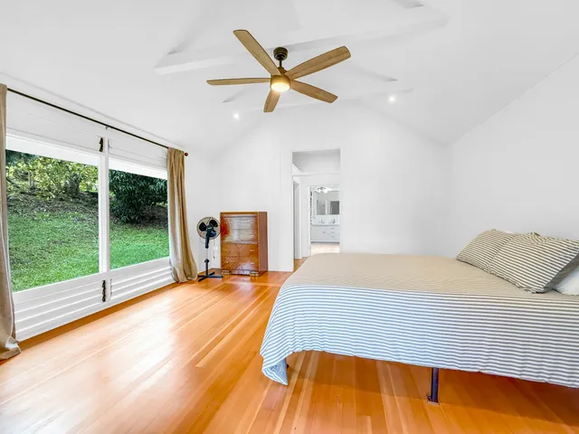 a bed room with a bed and a television